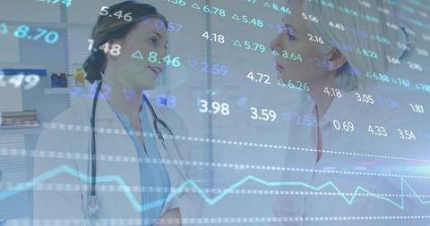 Doctors discussing clinic budget with financial data overlay and line graphs
