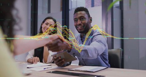 Diverse Team Collaborating with Digital Data Visualization in Office Setting