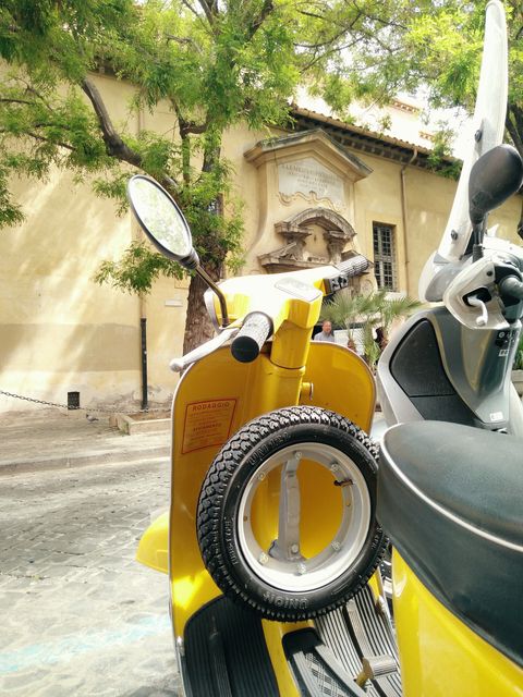 Yellow Scooter Parked Outdoors on Sunny Day - Download Free Stock Photos Pikwizard.com