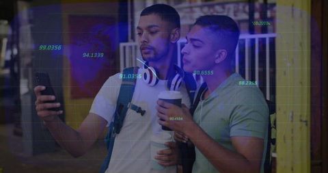 Two young men checking smartphone with blue data overlay in urban evening for analytics