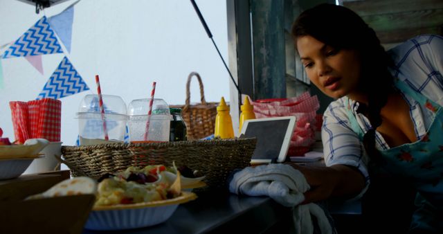 Food Vendor in Market Stall Preparing Dishes - Download Free Stock Images Pikwizard.com