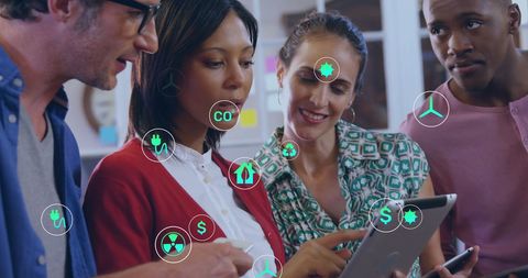 Diverse Team Collaborating with Eco Technology Icons