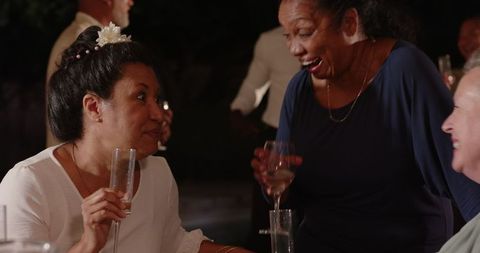 Joyful Evening Celebration with Laughter and Friendship Outdoors