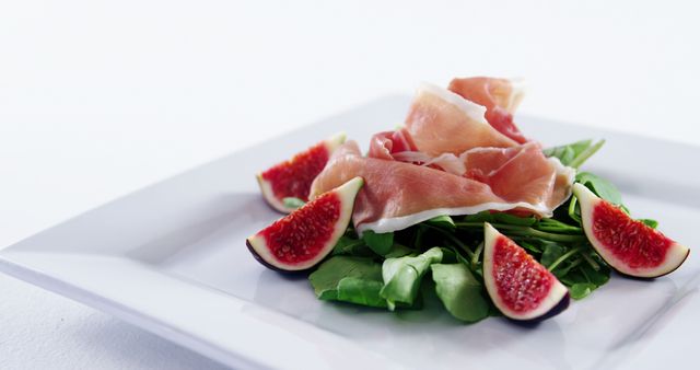 Prosciutto Wrapped Figs on Arugula and Spinach Salad - Download Free Stock Images Pikwizard.com