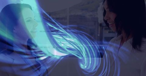 Business partners exchanging ideas through holographic teal-blue swirl in modern office