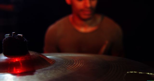 Drummer Performing with Red Light Reflection on Cymbal - Download Free Stock Images Pikwizard.com