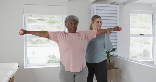 Senior Woman Exercising with Trainer at Home - Download Free Stock Images Pikwizard.com