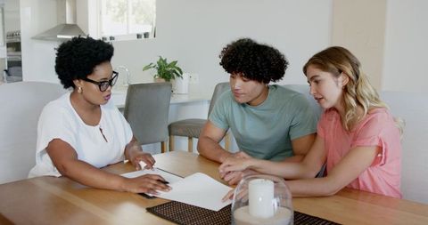 Diverse Couple Meeting with Consultant at Home