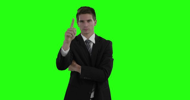 Confident Businessman Pointing Upward on Green Screen Background - Download Free Stock Images Pikwizard.com