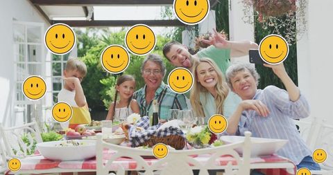Happy Family Taking Selfie in Garden With Smiley Face Overlay