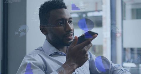 Black executive speaking into smartphone while viewing augmented reality data charts