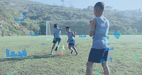 Boys Engaged in Soccer Training with Digital Overlays Outdoors