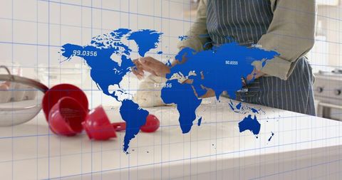 Home Baker Kneading Dough on Bright Counter with Blue World Map Overlay and Red Utensils