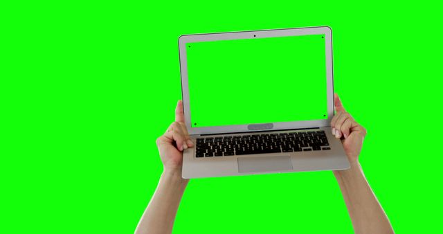 Hands holding laptop with green screen, isolated on green background - Download Free Stock Images Pikwizard.com