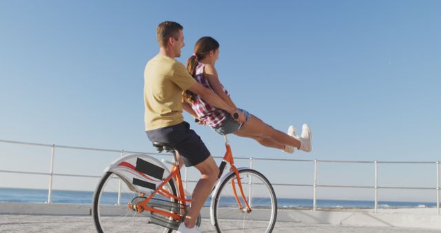 Couple Riding Bicycle Together by the Beach - Download Free Stock Images Pikwizard.com
