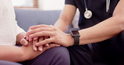 Healthcare Professional Supporting Senior Woman in Therapy Session