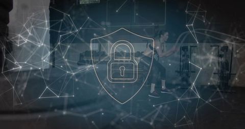 Midadult Woman Lunging in Gym with Digital Padlock Shield and Network Overlay for Fitness Security