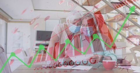 Senior Couple Analyzing Data with Graph Overlays Concept