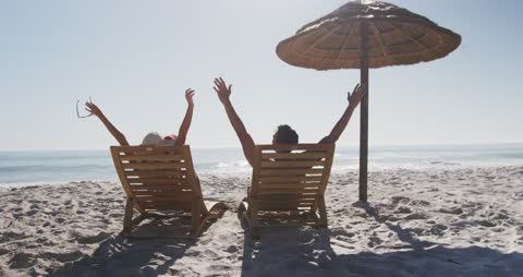 Romantic Escape: Couple Relaxing on Tropical Beach