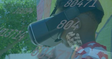 Boy interacting with augmented reality wearing vr headset