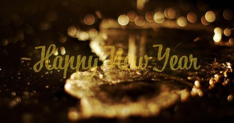 Golden Water Splash with Happy New Year Greeting