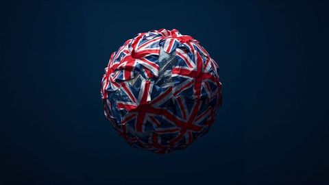 Abstract globe enveloped in british empire flags on dark background