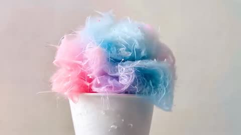 Pulling Back Revealing Pink and Blue Cotton Floss in White Paper Cup, Soft Pastel Texture