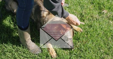 Senior Woman Caring for Dog in Lush Backyard
