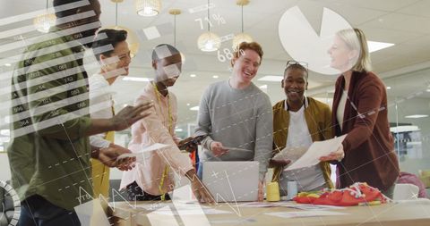 Diverse Team Collaboration with Tech Insights in Modern Office