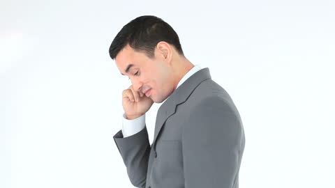 Confident Businessman Making Phone Call in Formal Suit