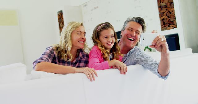 Happy Family Taking Selfie on Sofa - Download Free Stock Images Pikwizard.com