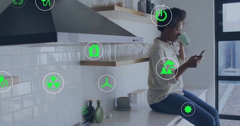 woman engaging with eco-friendly technology in kitchen - Download Free Stock Images Pikwizard.com
