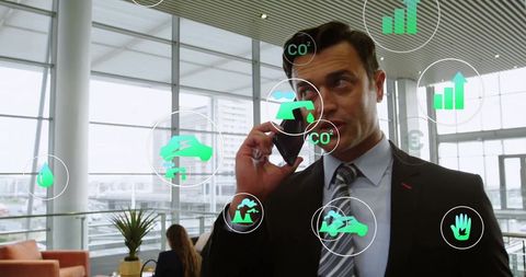 Businessman Discussing Sustainable Technology in Modern Lobby