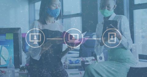 Women in Office Analyzing Digital Financial Data During Pandemic