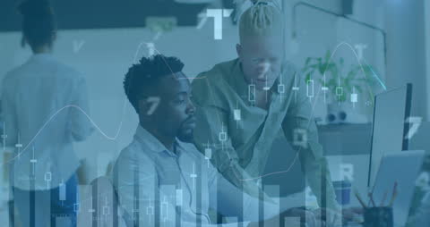 Diverse Colleagues Analyzing Financial Data on Computer Monitor