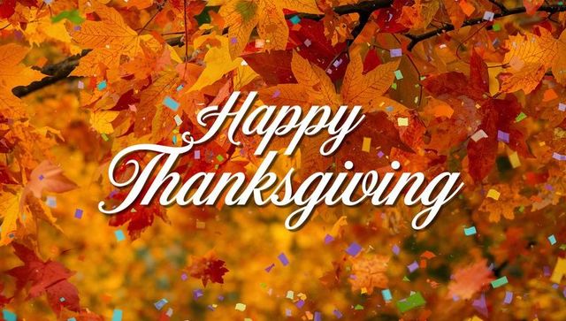 Happy thanksgiving script lettering over golden autumn leaves with falling confetti