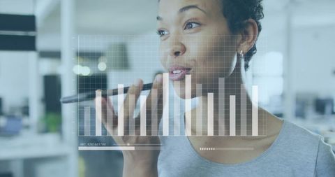 Businesswoman using voice input for data analysis visualization