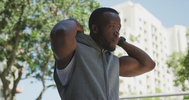 Athletic man preparing for outdoor workout in city park - Download Free Stock Images Pikwizard.com