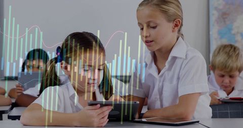Children Using Tablets in Classroom with Financial Data Overlay