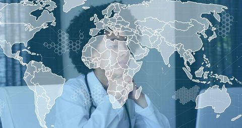 Focused healthcare professional in office with world map overlay