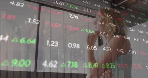 Businesswoman Analyzing Global Stock Market Trends in Modern Office