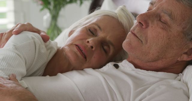 Senior Caucasian couple shares a tender moment at home, with copy space - Download Free Stock Photos Pikwizard.com