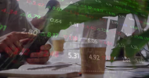 Businessman with Smartphone Amidst Financial Data Overlay