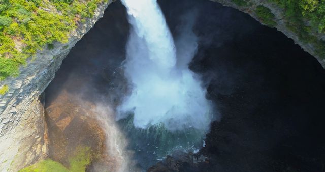 Aerial View of Powerful Waterfall Cascading into Deep Gorge - Download Free Stock Images Pikwizard.com