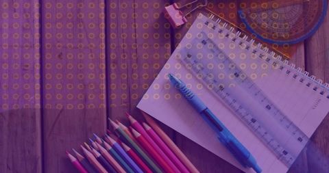 Creative Workspace with Spiral Notebook and Colored Pencils