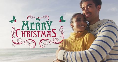 Biracial Couple Embracing at Beach with Merry Christmas Message