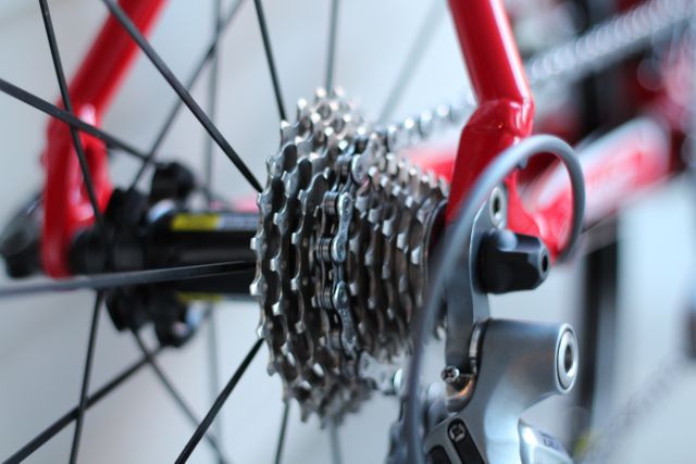 Perfect for materials on bicycle maintenance, cycling enthusiasts, mechanical engineering, and sports equipment. Useful in educational content illustrating how bike gears work or in advertisements for high-quality cycling gear and bicycles.