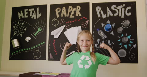 Portrait of Smiling Girl Promoting Environmental Awareness in Classroom
