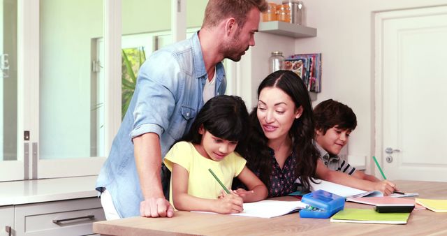 Happy Family Helping Children with Homework at Kitchen Counter - Download Free Stock Images Pikwizard.com