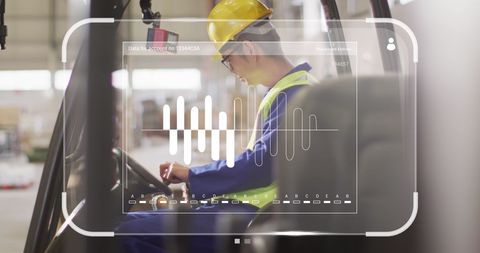 Asian Warehouse Worker Operating Digital Interface